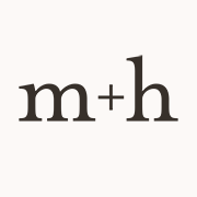 milk + honey | Downtown Austin logo